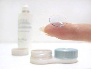 contact lens on finger